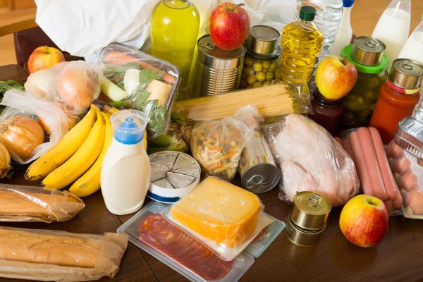 View at table with articles of food for  family  in home